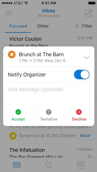 Shows a mobile screen, with a summarized invitation to an event. The expand arrow is at the top of the screen, pointing down